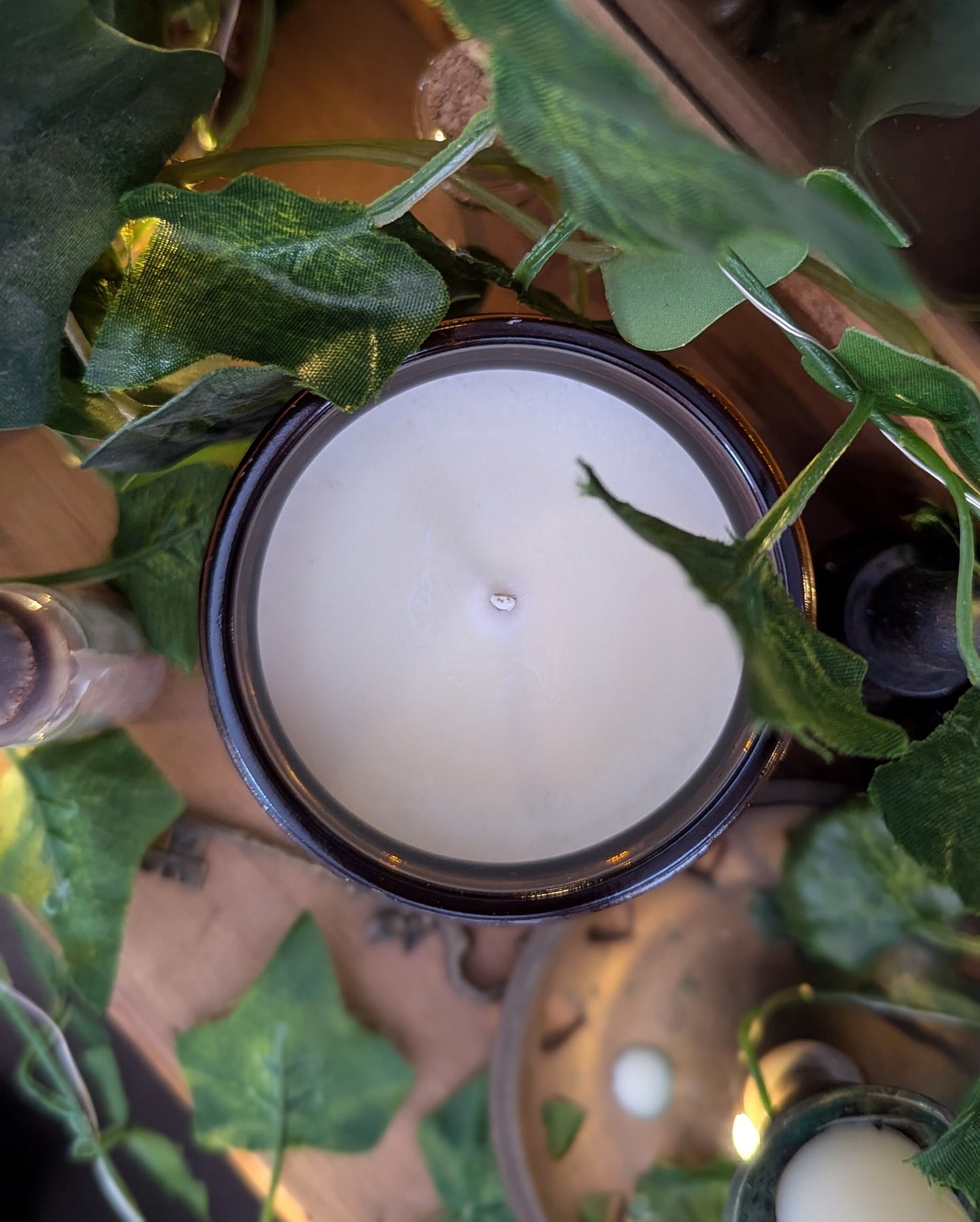Practical Magic Luxury Scented Candle - 100% organic soy wax with premium essential oils in amber glass jar.