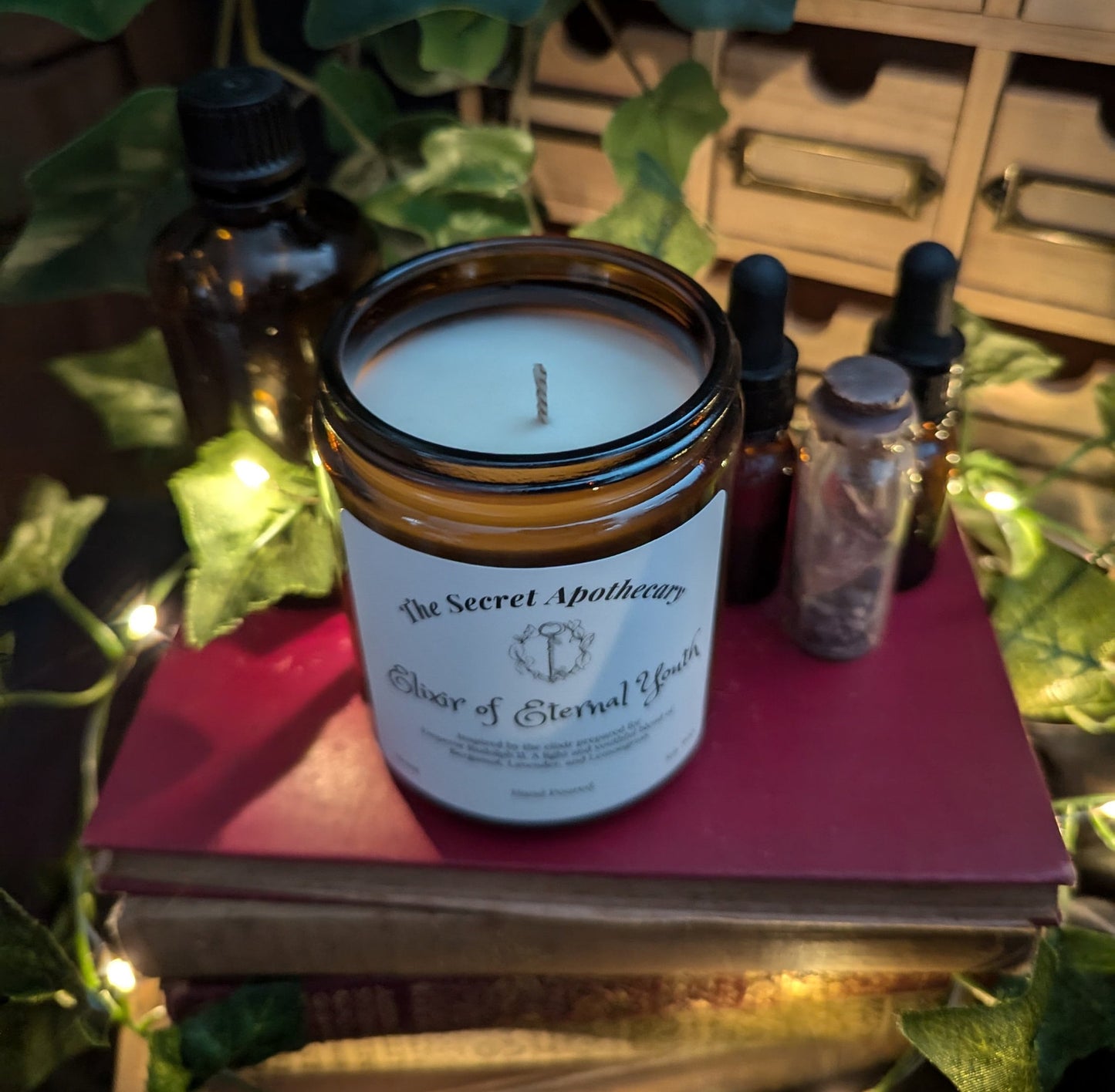 Elixir of Eternal Youth - Luxury Scented Candle. Alchemist Range. 100% organic soy wax candle with premium essential oils in amber glass jar