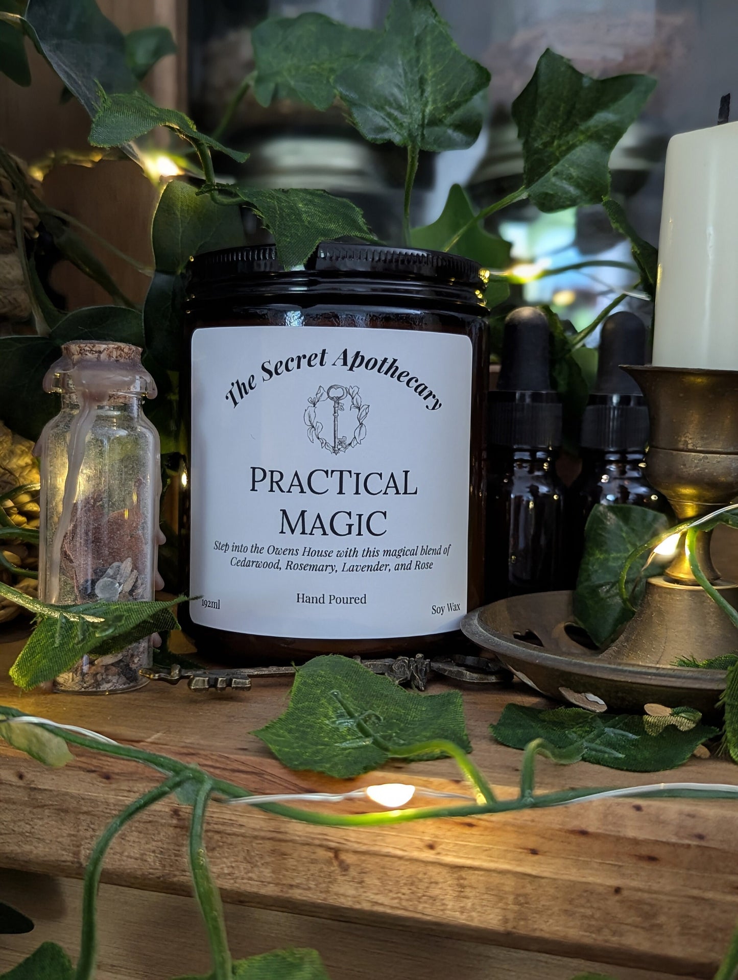 Practical Magic Luxury Scented Candle - 100% organic soy wax with premium essential oils in amber glass jar.