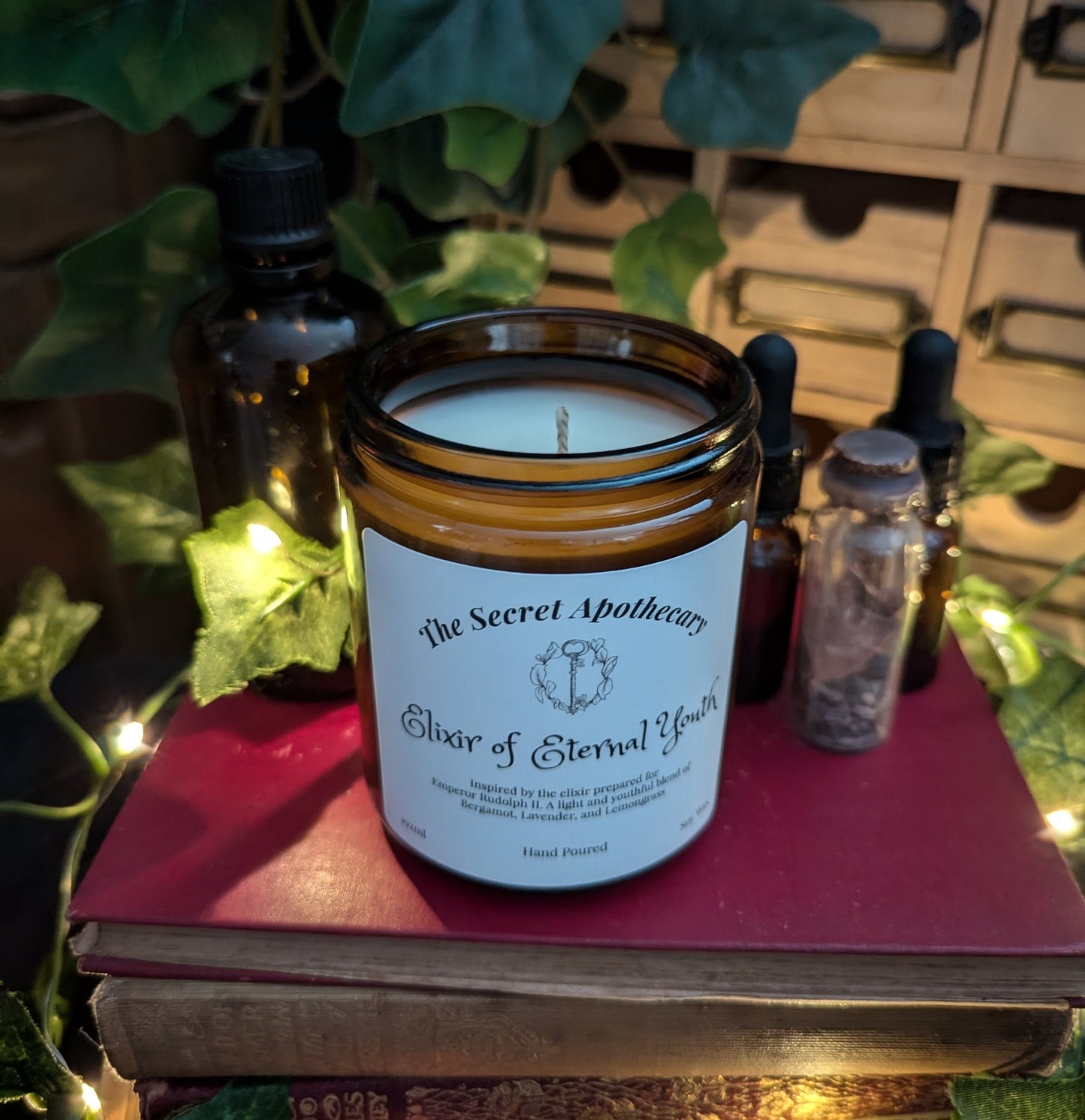 Elixir of Eternal Youth - Luxury Scented Candle. Alchemist Range. 100% organic soy wax candle with premium essential oils in amber glass jar