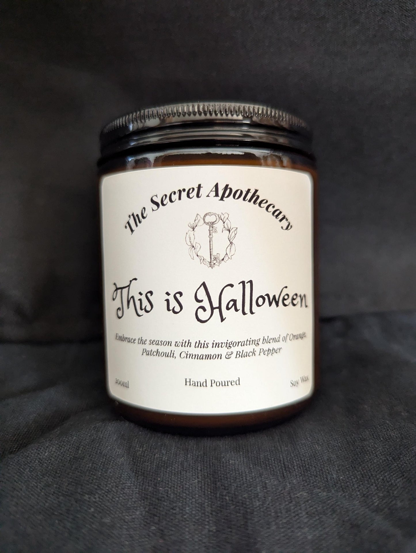This is Halloween Luxury Scented Candle - 100% organic soy wax with premium essential oils in amber glass jar. Nightmare Before Christmas.