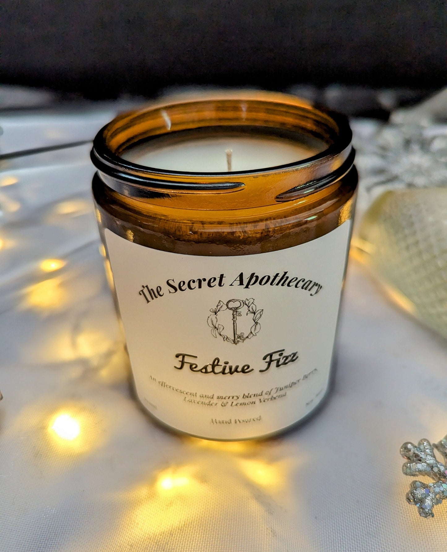 Festive Fizz Luxury Scented Candle - 100% organic soy wax candle with premium essential oils in amber glass jar. Eco friendly.
