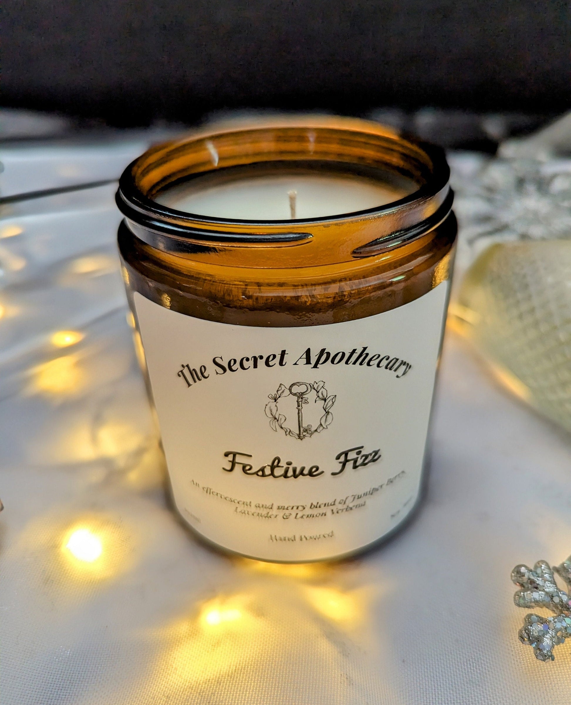 Festive Fizz Luxury Scented Candle - 100% organic soy wax candle with premium essential oils in amber glass jar. Eco friendly.