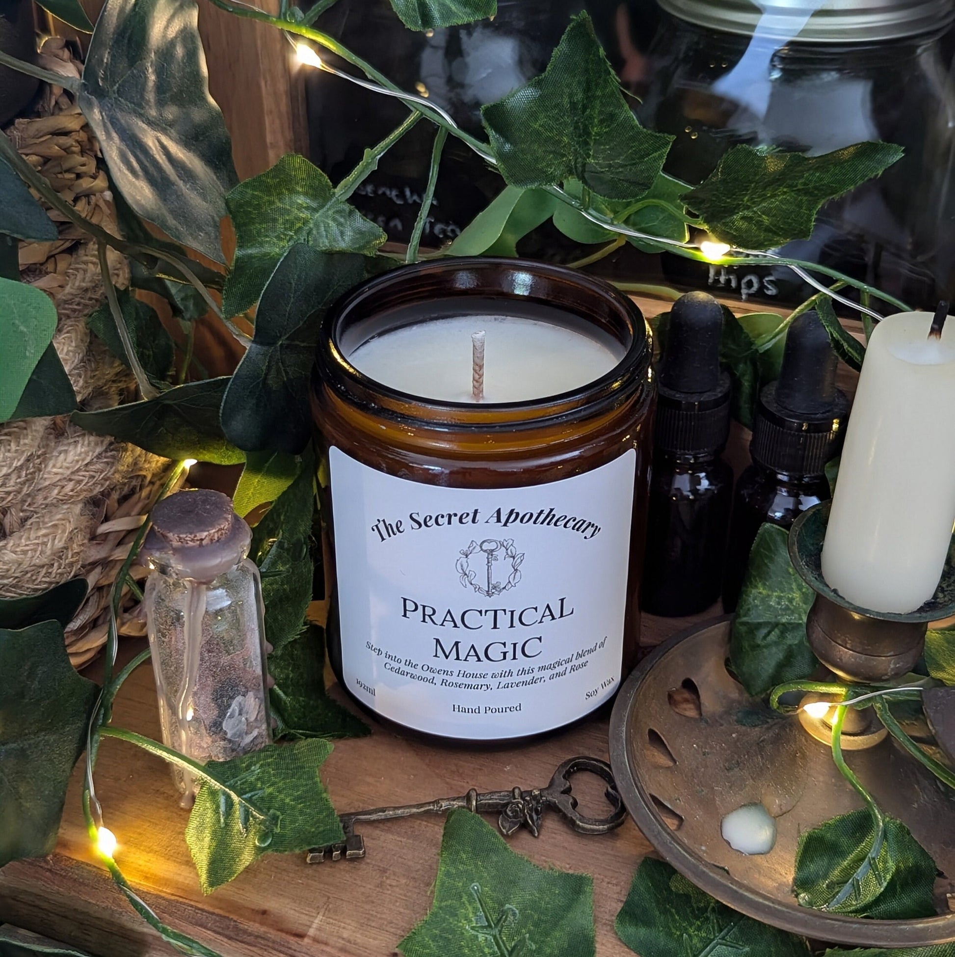 Practical Magic Luxury Scented Candle - 100% organic soy wax with premium essential oils in amber glass jar.