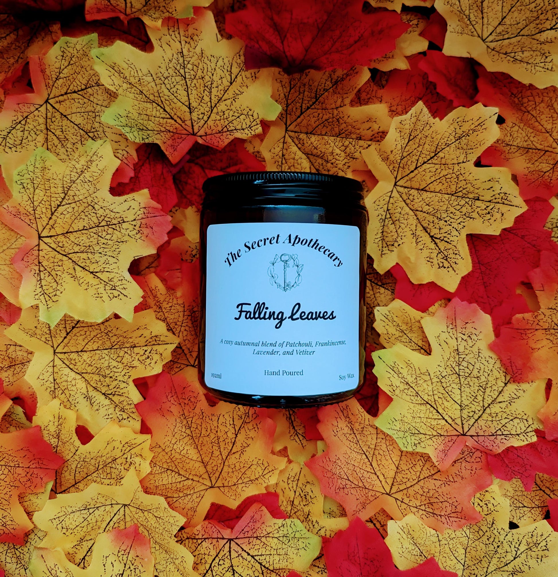 Falling Leaves Luxury Scented Candle - 100% organic soy wax candle with premium essential oils in amber glass jar. Eco friendly.