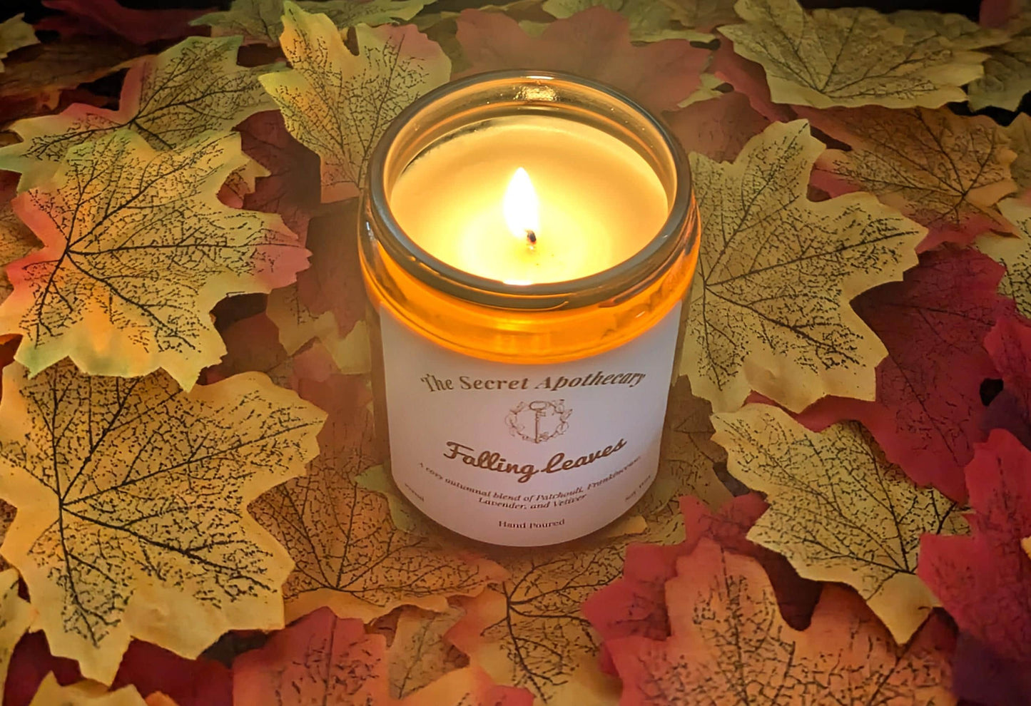 Falling Leaves Luxury Scented Candle - 100% organic soy wax candle with premium essential oils in amber glass jar. Eco friendly.