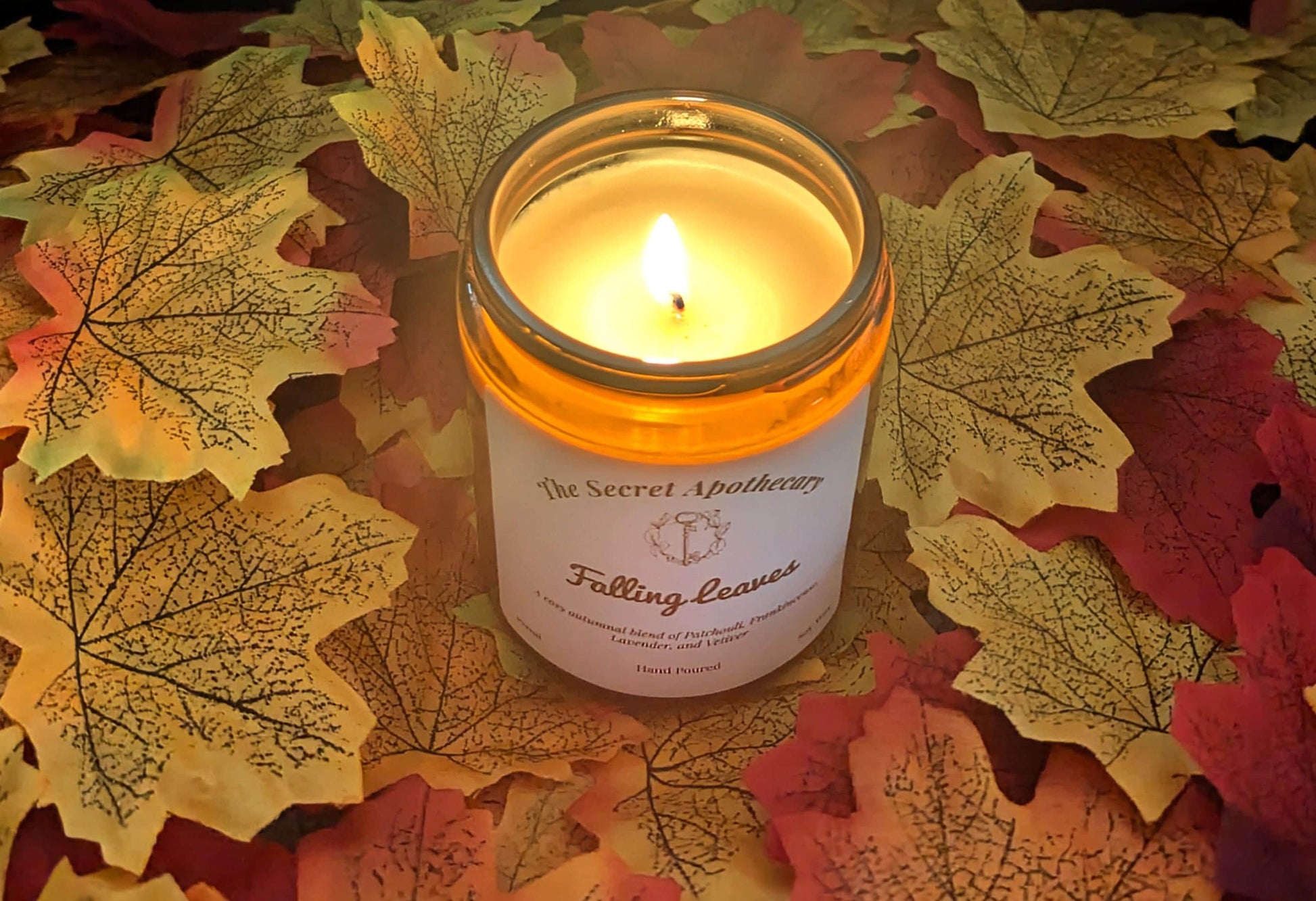 Falling Leaves Luxury Scented Candle - 100% organic soy wax candle with premium essential oils in amber glass jar. Eco friendly.